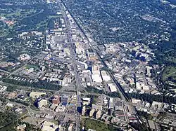 Aerial view of dense urban development surrounded by suburban development