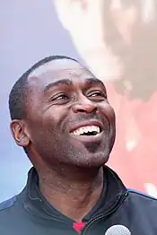 Andy Cole, who is seen smiling, started his professional career at Arsenal, before later finding success at Newcastle and Manchester United.