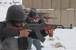 Afghan Police officers fire their PM md. 63 assault rifles.