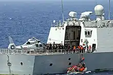 Aft-deck of frigate Yiyang (548). In this image, US Navy sailors are boarding to meet prior to conducting a bilateral counter-piracy exercise. Visible on the flight deck is a Harbin Z-9 helicopter