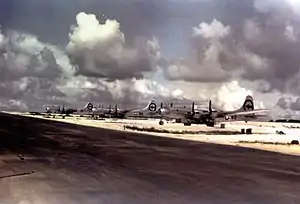 Left to right: Big Stink, The Great Artiste, and Enola Gay parked next to a North runway