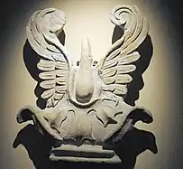 A sculpture known as a "palmette antefix" displaying large leaf fronds