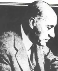 a black and white newspaper photo of Van Laer who is looking down and to the side and appears to be a white man