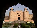 Entrance gate to a fort flanked by two large towers.