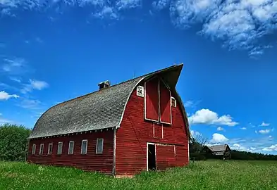 Pointed hay hood on a round-roofed barn in Alberta, Canada