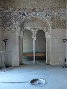 Interior of the central chamber, with floor fountain and arched entry to side chamber