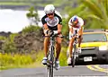 Frontrunners of Stage Two 171 mile bike followed by a media vehicle along the Red Road