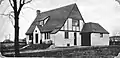 Front view of French-style home designed by Schimek in La Grange, Illinois, as seen in 1925.