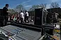 The mixing console for a sound engineer close to a stage where a musical group performs