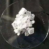 White crystals of alum on a glass-like plate