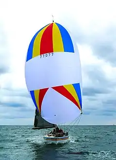 Symmetric spinnaker while running downwind, primarily generating drag.