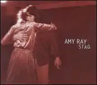 A red-tinted photo of two persons dancing