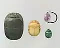 Scarab beetles were one of the most common material objects made by the ancient Egyptians.  These scarabs, from the Middle Kingdom, were likely used as jewelry, specifically amulets.  The scarab beetle is symbolic of Khepri, the Egyptian sun deity who represents creation and rebirth[9].