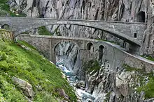 The modern concrete span of the third Devil's Bridge (Teufelsbrücke, built 1958) showing an older bridge (built 1830) below