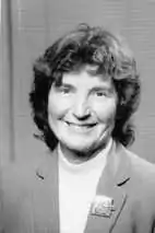 black and white headshot of a white woman smiling