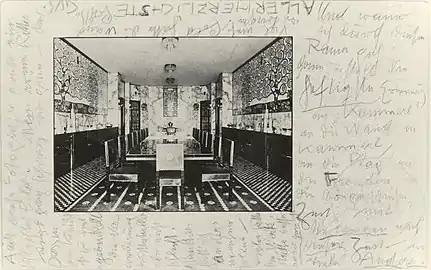 Photograph of the Stoclet Palace's dining room, with furniture by Hoffmann and ceramic frieze by Gustav Klimt