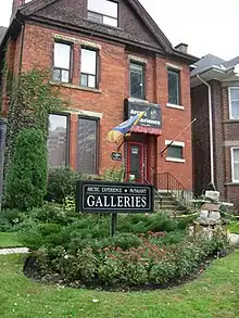 A summer shot of the building -- an old Victorian home.