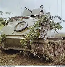 Colour photo of a tracked military vehicle