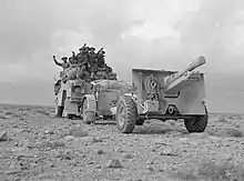 Photograph of a field gun and an artillery tractor