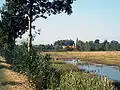 Assebroekse Meersen with in the background the church of Ver-Assebroek