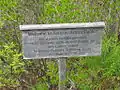 A sign at the entrance from the Routes 3/198 parking lot near the northeast corner of the Garden