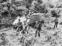 Black and white photo of a tracked military vehicle