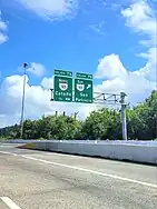 PR-22 east approaching exits 7A-B to PR-165 in Guaynabo