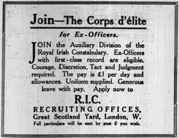 A newspaper advertisement, solely text reading: "Join – The Corps d'élite for Ex-Officers. Join the Auxiliary Division of the Royal Irish Constabulary. Ex-Officers with first-class record are eligible. Courage, Discretion, Tact and Judgement required. The pay is £1 per day and allowances. Uniform supplied. Generous leave with pay. Apply now to RIC RECRUITING OFFICES, Great Scotland Yard, London, W. Full particulars will be sent by post if you wish."