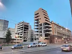 Damaged building "A" in 2019, showing some of the rubble cleared away as part of the post-2015 cleanup process.