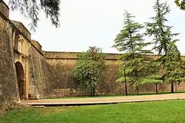 Gate of La Trinidad and southwest-facing curtain wall