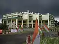 The Administrative Building under clouds.