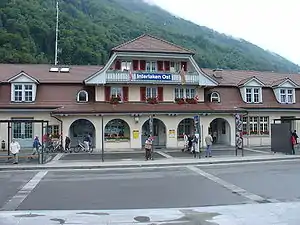 Three-story station building with Dutch gabled roof