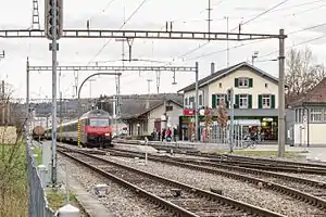 Low platforms with canopies and a two-story building to one side