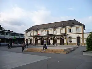 Wide two-story building with hip roof