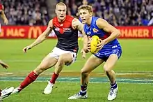 Bailey Dale evades Tom McDonald in Round 13, 2017