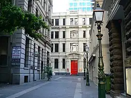 Victorian architecture featuring ornate heritage lamp posts and bluestone alleys in Bank Place, Melbourne.