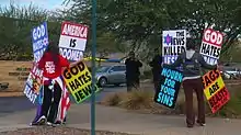 Members of the Westboro Baptist Church protesting a Jewish Community Centre. Phelps-Roper would join her church members at protests similar to this one.