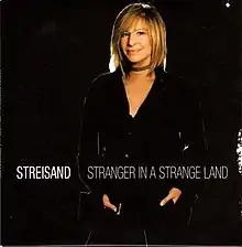 A color photograph of Streisand appears along with her name and the song title in white below her.