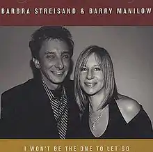 A black and white photograph of Streisand and Manilow appears along with their names in red above them and the title of the song in yellow below them.