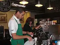 Baristas working inside the store in 2011