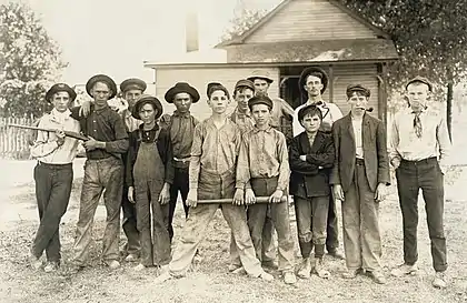 Image 9Photograph of glassworkers by Lewis HinePhotograph: Lewis Hine; restoration: Lise BroerA baseball team composed mostly of child laborers from an Indiana glassmaking factory, as photographed by Lewis Hine in August 1908. Hine (1874–1940) was an American sociologist who promoted the use of photography as an educational medium and means for social change. Beginning in 1908, he spent ten years photographing child labor for the National Child Labor Committee. The project was a dangerous one, and Hine had to disguise himself – at times as a fire inspector, post card vendor, Bible salesman or industrial photographer – to avoid the factory police and foremen.More featured pictures