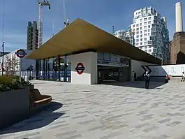 A single-storey building with a wide projecting canopy with the Underground sign on the side