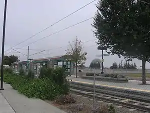 Bayshore/NASA station with remains of Hangar One in background