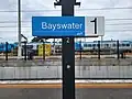 Platform 1 sign, November 2022. The train maintenance depot is in the background.