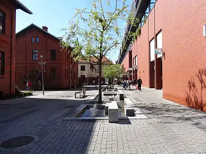 Entrance with historic abattoir buildings on the left