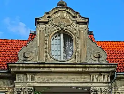 Adorned wall dormer