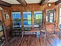 Windows between cottage living room and beaver pool.