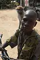 Beninese boy with pet monkey