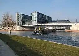 Barge entering the canal from the River Spree by the new Hauptbahnhof