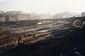 Old Bradford Forster Square station prior to demolition in 1990. Construction workers can be seen in the foreground ready to start work on the new station